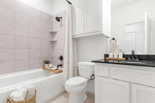 a bathroom with a sink a toilet and bathtub