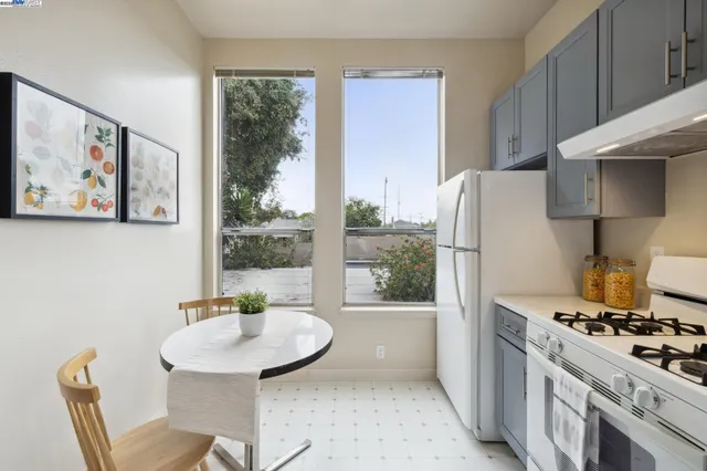 a kitchen with a stove a sink and a refrigerator