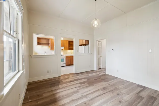 a kitchen with a sink a stove and a refrigerator