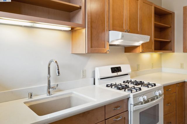 a view of a room with wooden floor and window