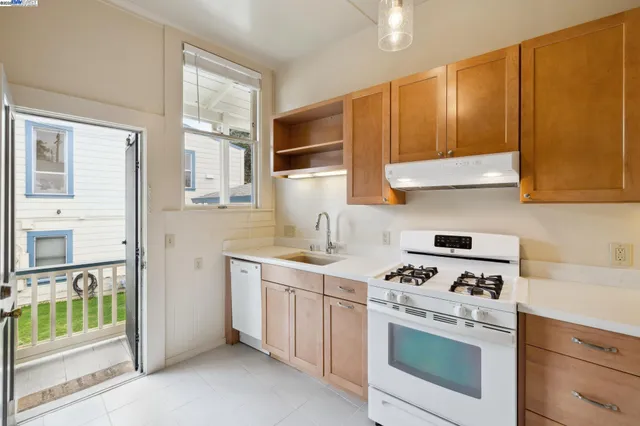 a bathroom with a toilet sink shower and mirror