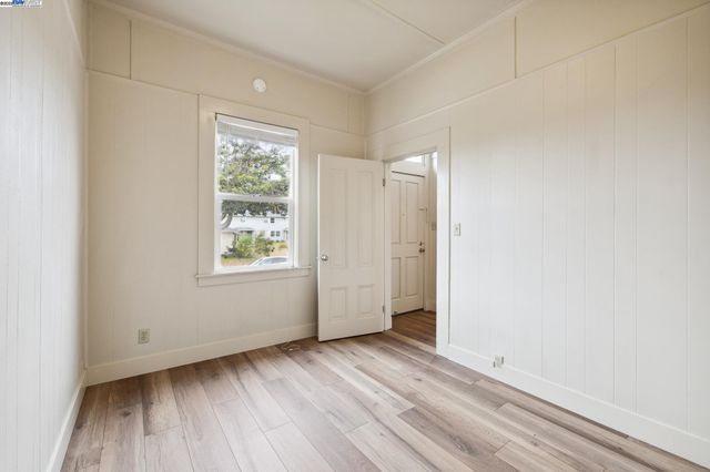 a view of a house with a yard and pathway