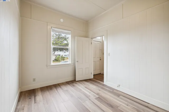 a view of a house with a yard and pathway