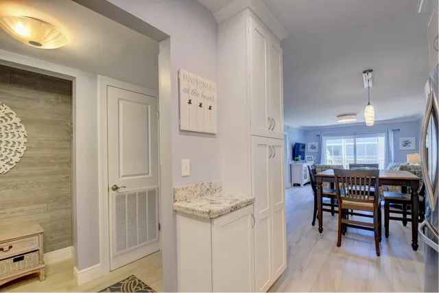 a view of a dining room with furniture and chandelier