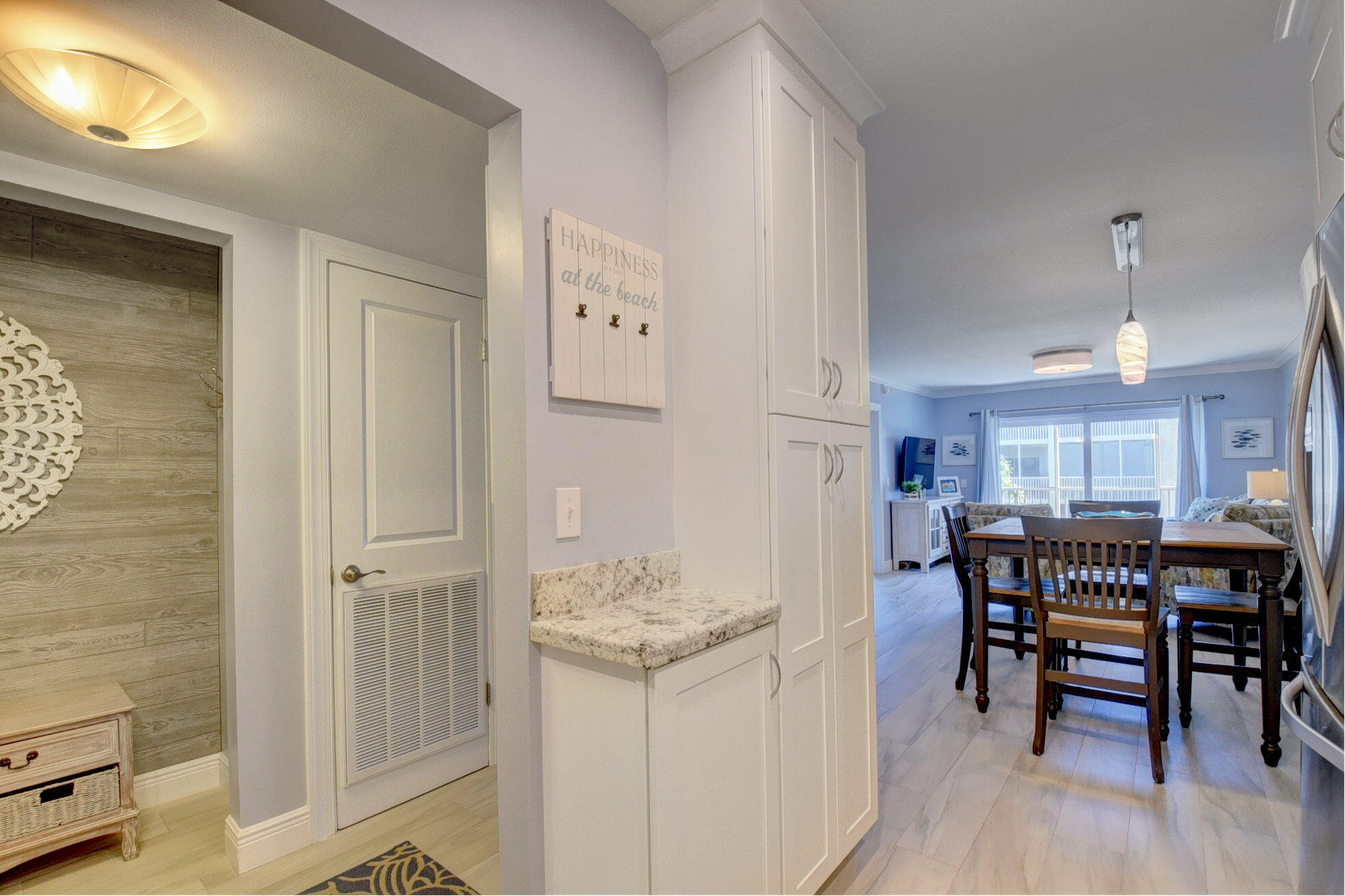 650 Snug Harbor Drive, Unit G307 Boynton Beach, FL 33435 - Photo 19 of 58 a view of a dining room with furniture and chandelier