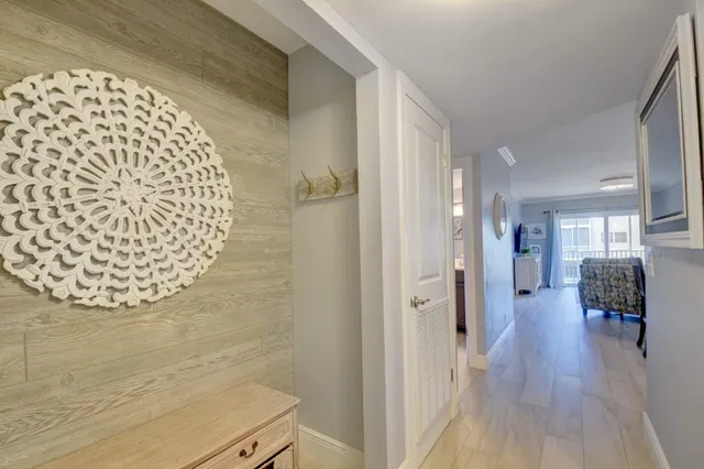 a view of livingroom and dining room with wooden floor