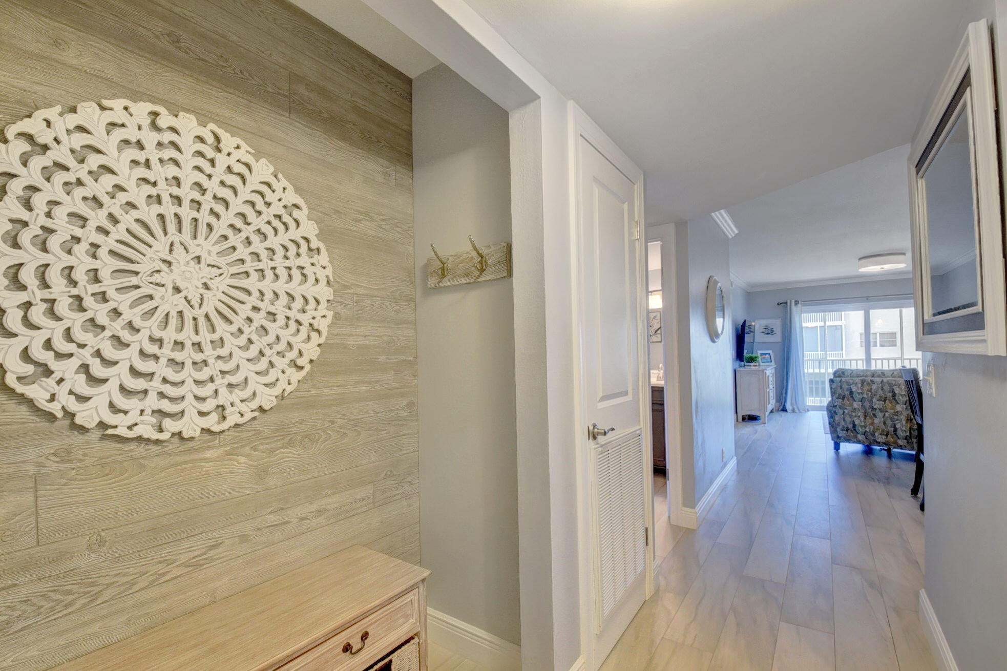 650 Snug Harbor Drive, Unit G307 Boynton Beach, FL 33435 - Photo 2 of 58 a view of livingroom and dining room with wooden floor