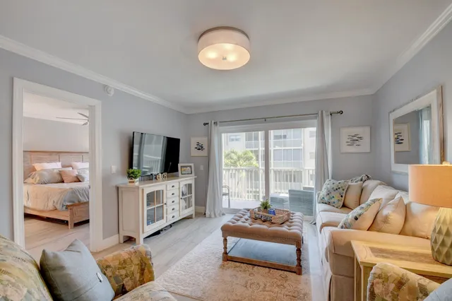 a living room with furniture and a lamp