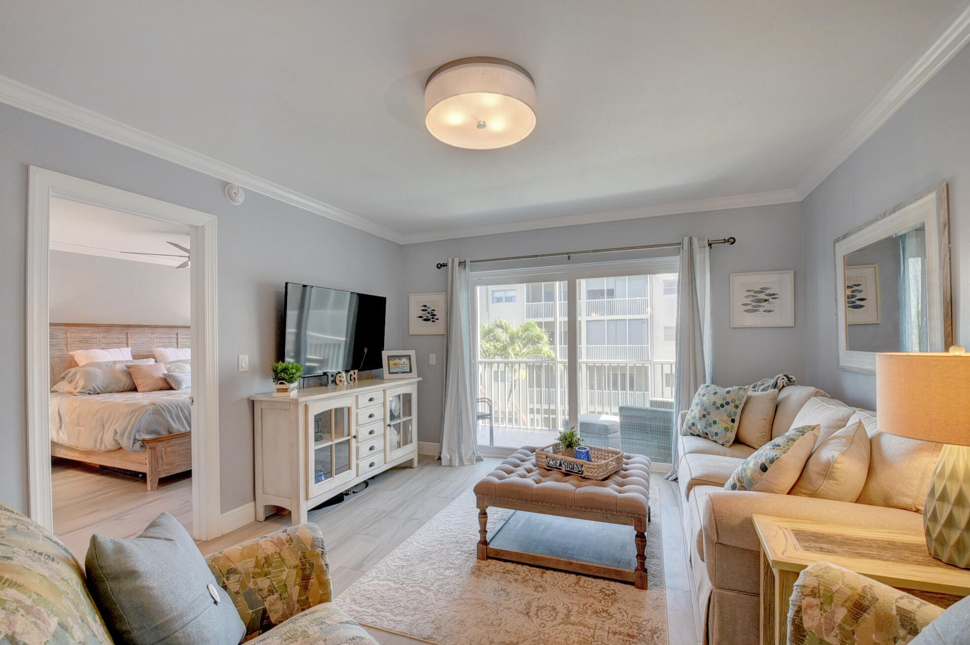 650 Snug Harbor Drive, Unit G307 Boynton Beach, FL 33435 - Photo 21 of 58 a living room with furniture and a flat screen tv