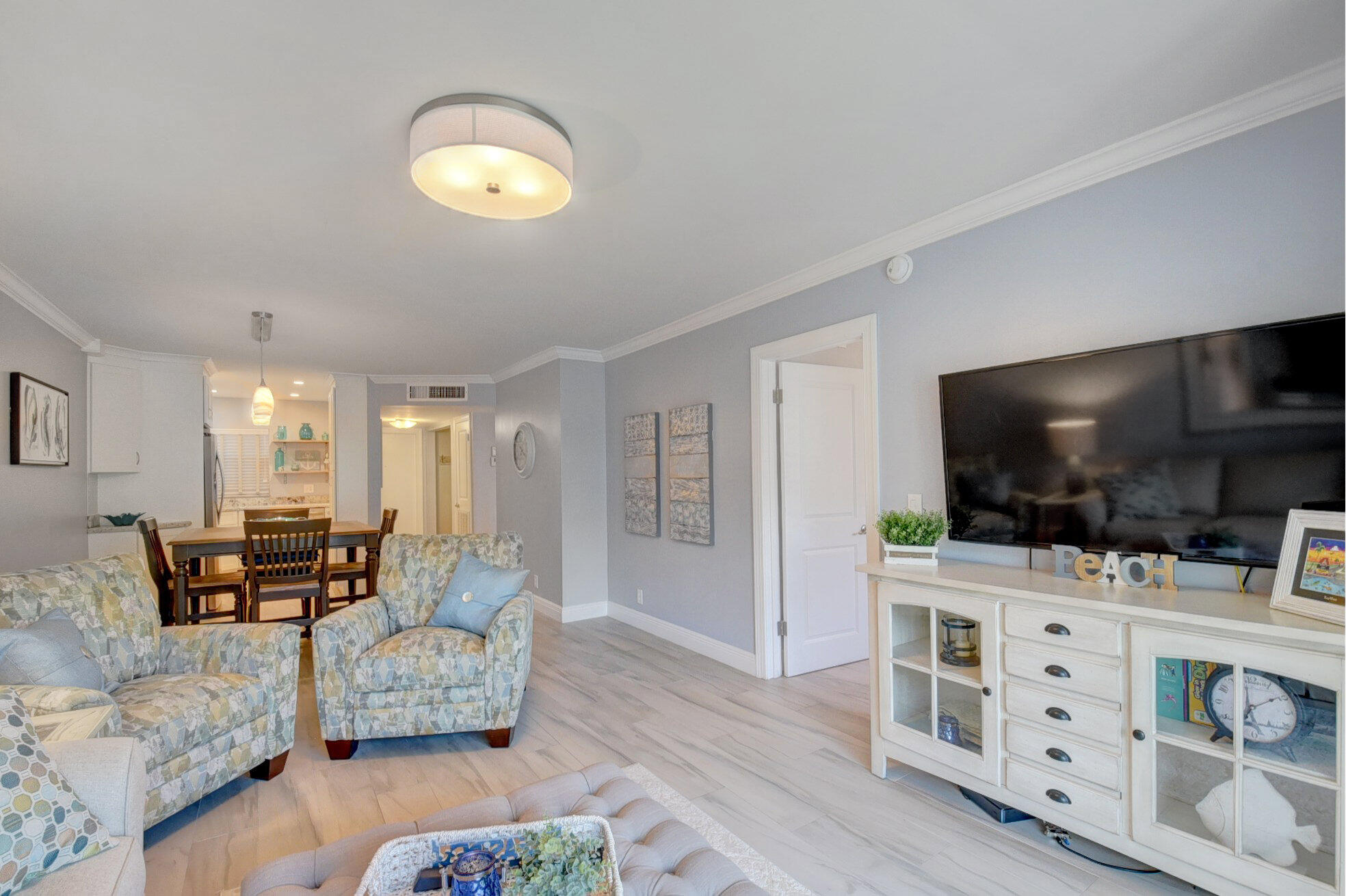 650 Snug Harbor Drive, Unit G307 Boynton Beach, FL 33435 - Photo 23 of 58 a living room with furniture and a flat screen tv