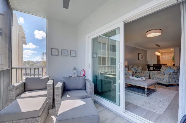 a view of a balcony with furniture