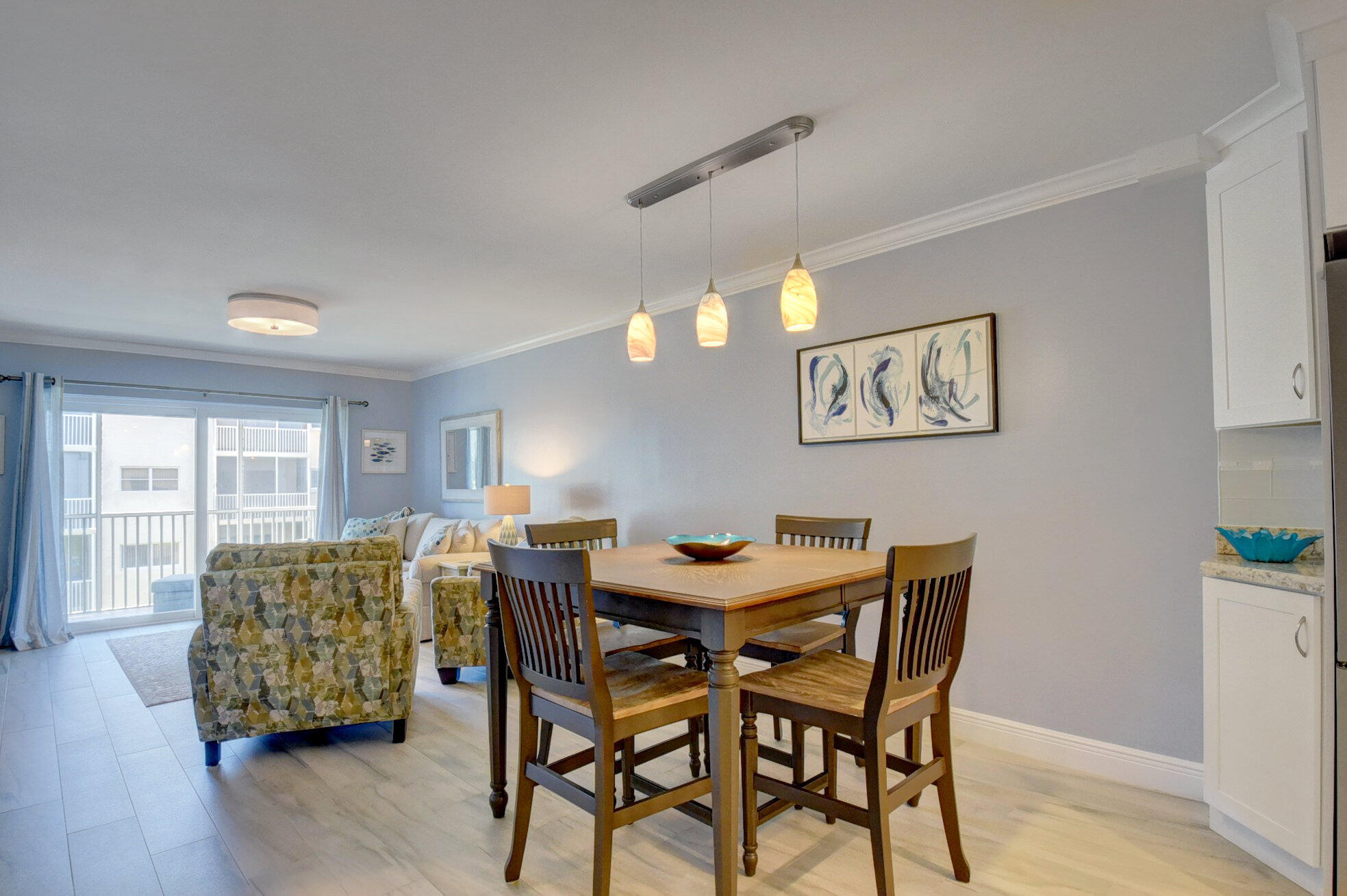 650 Snug Harbor Drive, Unit G307 Boynton Beach, FL 33435 - Photo 8 of 58 a view of a dining room with furniture and wooden floor