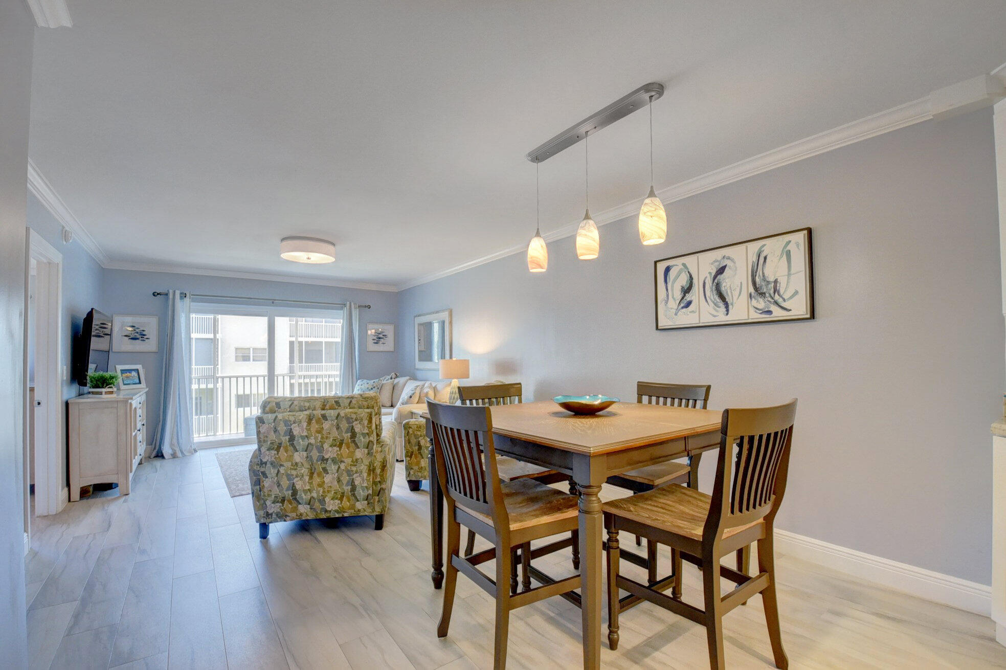 650 Snug Harbor Drive, Unit G307 Boynton Beach, FL 33435 - Photo 9 of 58 a view of a dining room with furniture and wooden floor