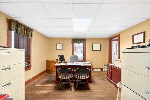 a dining room with furniture and window