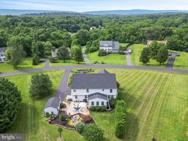 an aerial view of a house with a garden