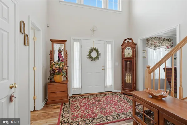 a living room with furniture and a piano