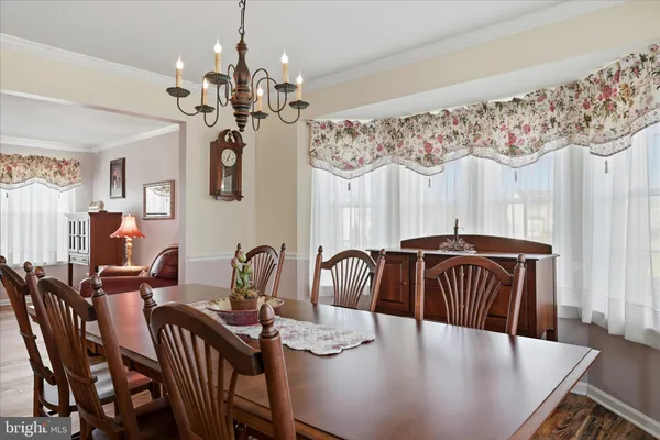 a kitchen with stainless steel appliances kitchen island granite countertop a stove refrigerator and microwave