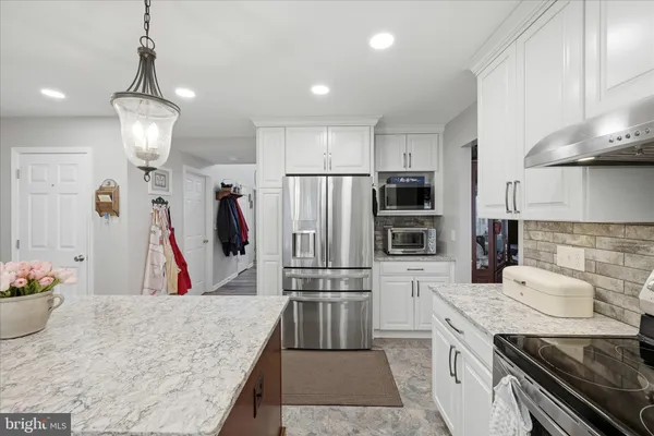 a living room with furniture fireplace and a flat screen tv