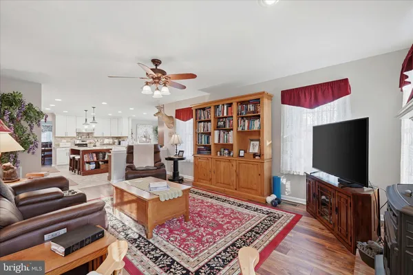 a bathroom with a window sink and a mirror