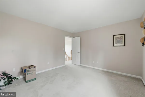 a bathroom with a toilet and a shower curtain