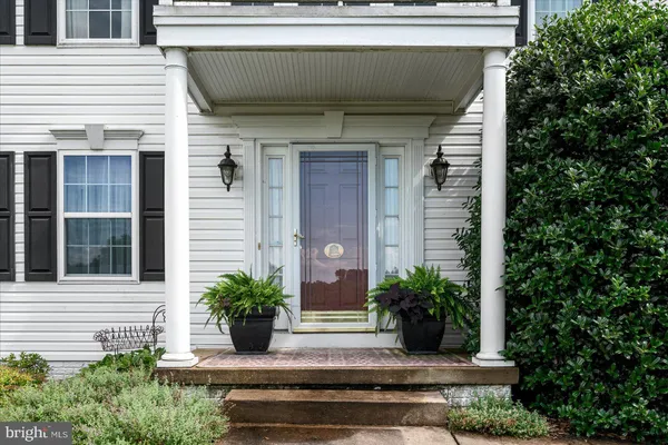 a view of a entryway door front of house