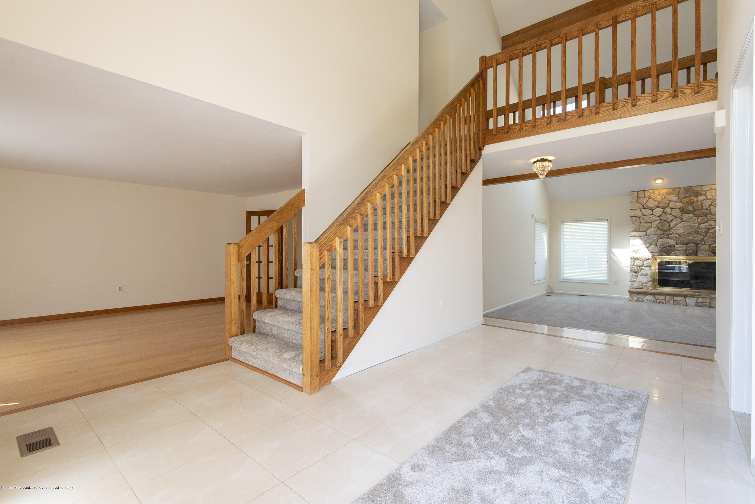 19 Riverside Lane Holmdel, NJ 07733 - Photo 14 of 40 a view of staircase with white walls and a rug