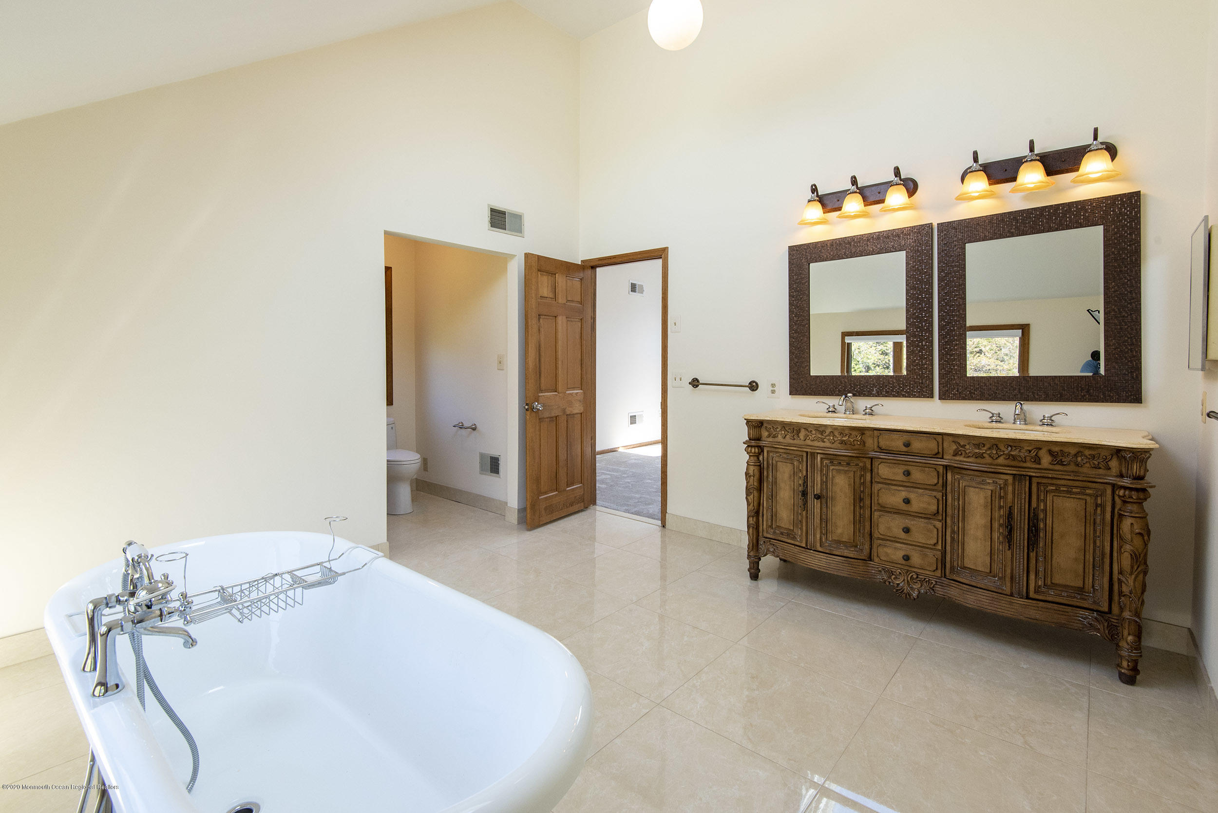 19 Riverside Lane Holmdel, NJ 07733 - Photo 22 of 40 a en suite bathroom with a sink and a mirror