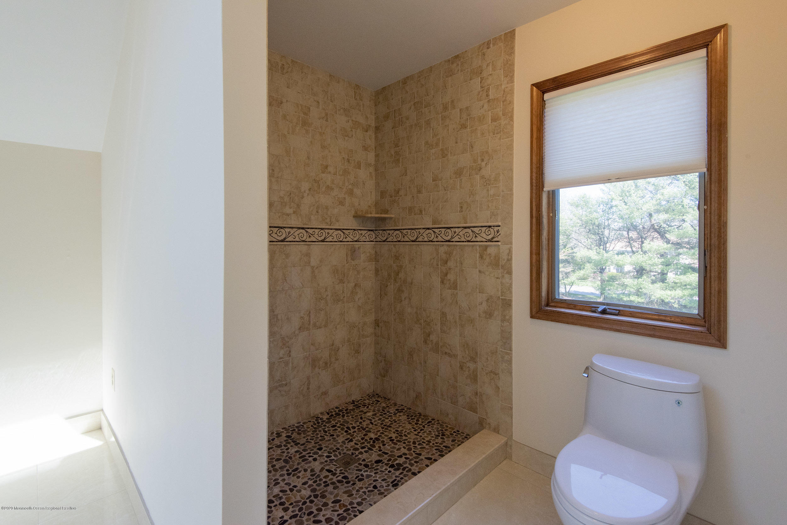 19 Riverside Lane Holmdel, NJ 07733 - Photo 23 of 40 a bathroom with a toilet and a shower