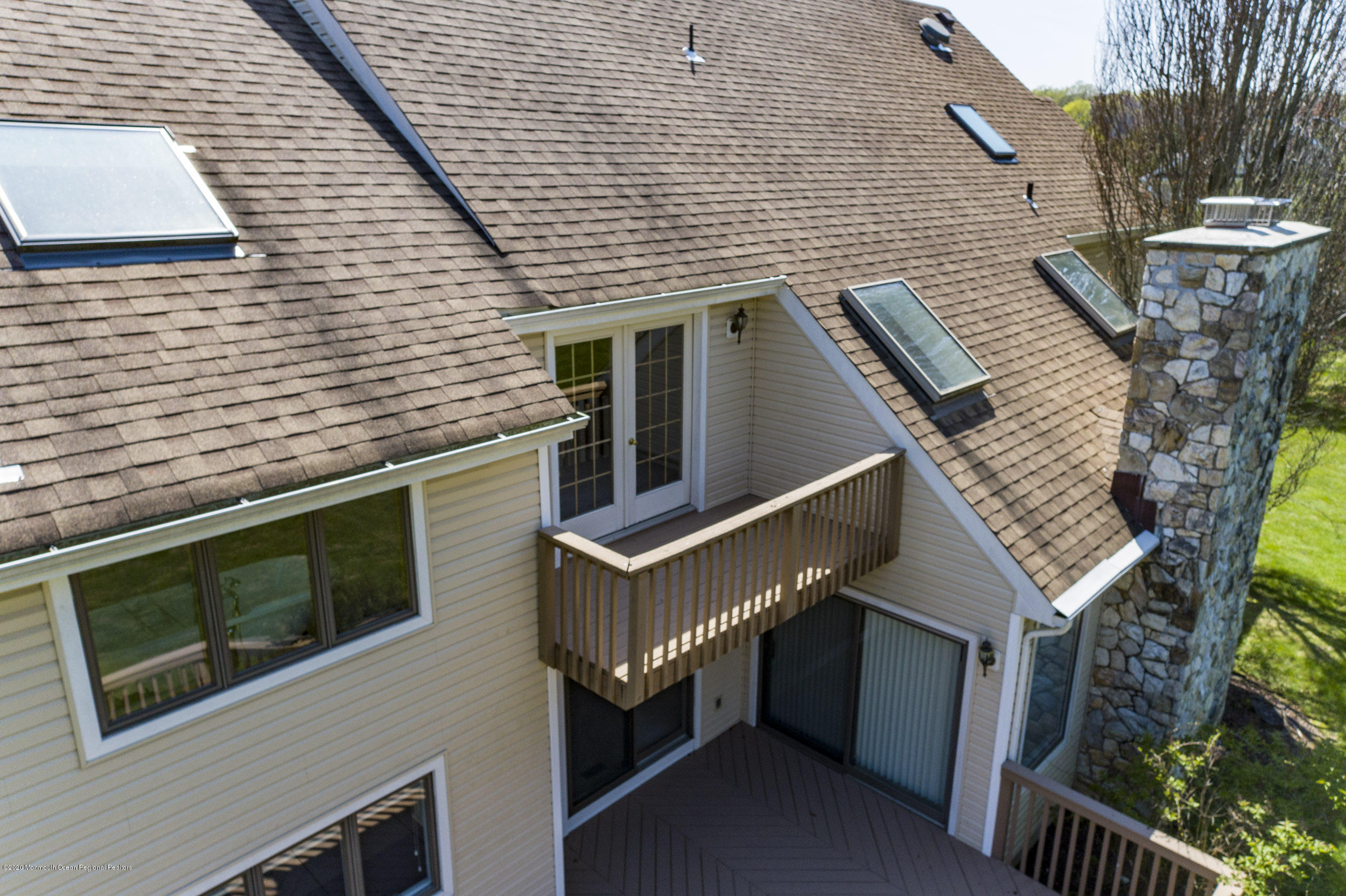 19 Riverside Lane Holmdel, NJ 07733 - Photo 36 of 40 a view of a house with a deck