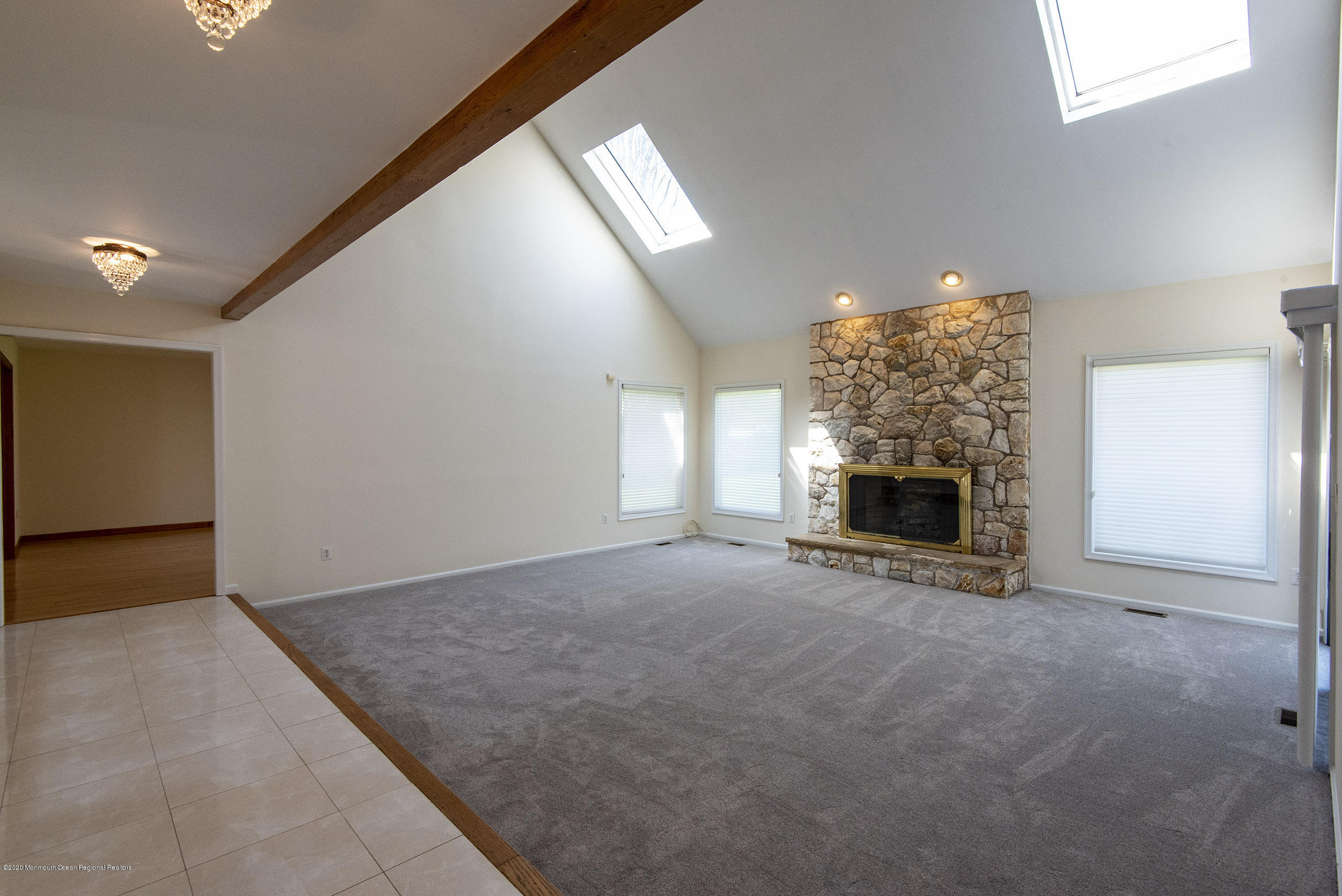 19 Riverside Lane Holmdel, NJ 07733 - Photo 6 of 40 a view of empty room with fireplace and window