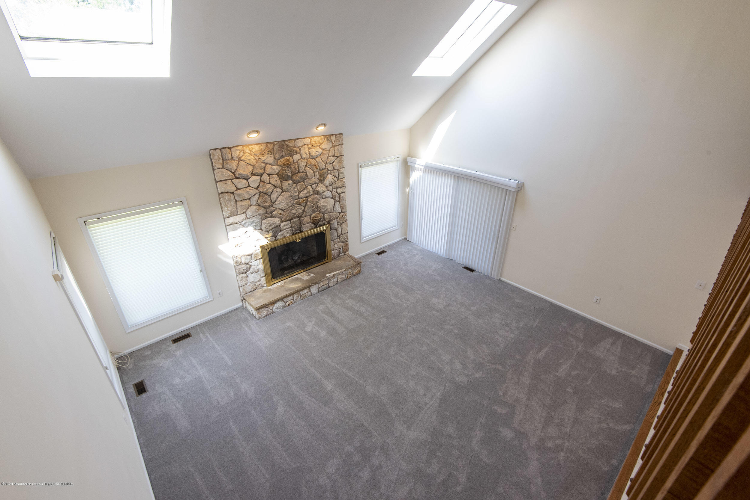 19 Riverside Lane Holmdel, NJ 07733 - Photo 7 of 40 a view of empty room with windows