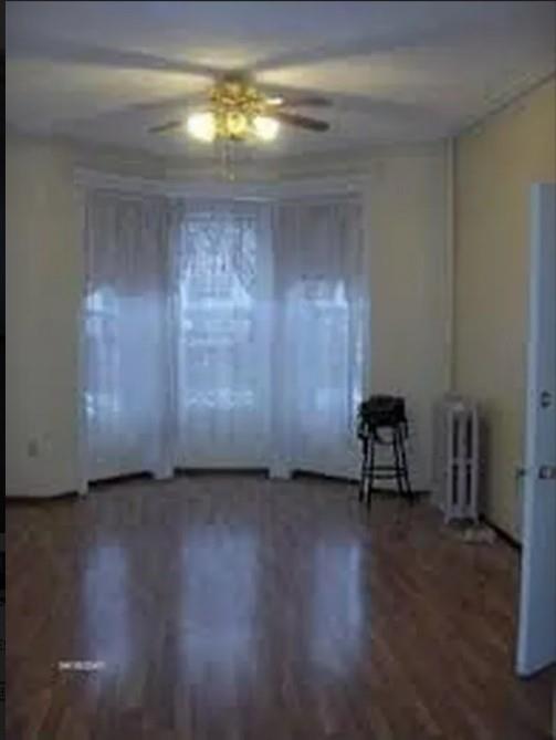 1595 Union Street Brooklyn, NY 11213 - Photo 17 of 21 a view of a livingroom with wooden floor and a window