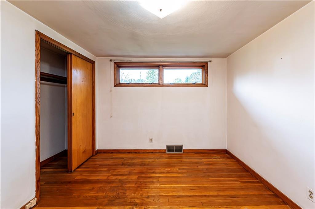 13740 Ridge Road Irwin, PA 15642 - Photo 23 of 43 a view of empty room with wooden floor