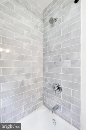 a bed room with a bed and a window