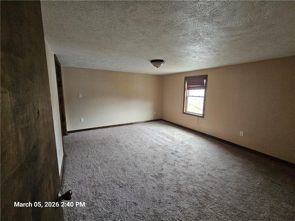 233 Main Street Bruin, PA 16022 - Photo 8 of 12 an empty room with windows