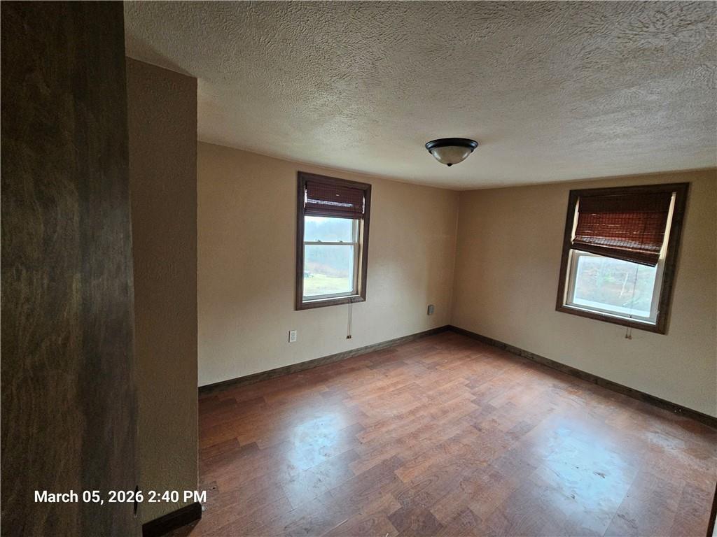 233 Main Street Bruin, PA 16022 - Photo 9 of 12 an empty room with windows