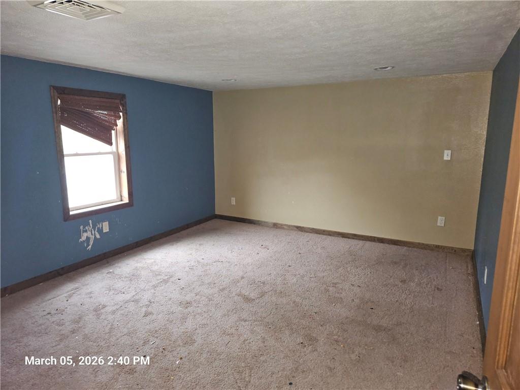 233 Main Street Bruin, PA 16022 - Photo 10 of 12 an empty room with a window