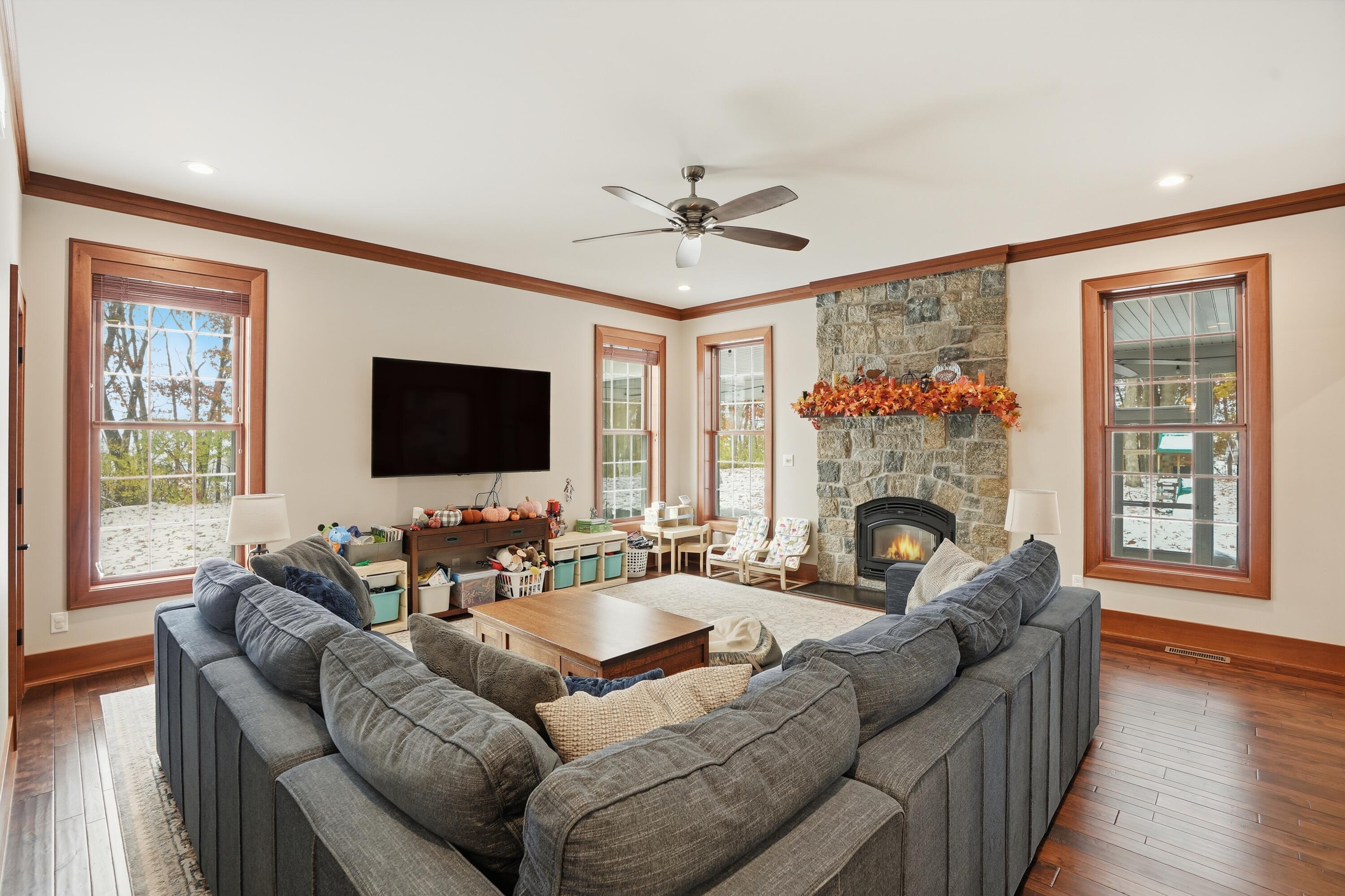 804 Shannon Drive Crown Point, IN 46307 - Photo 27 of 79 a living room with furniture fireplace and a flat screen tv