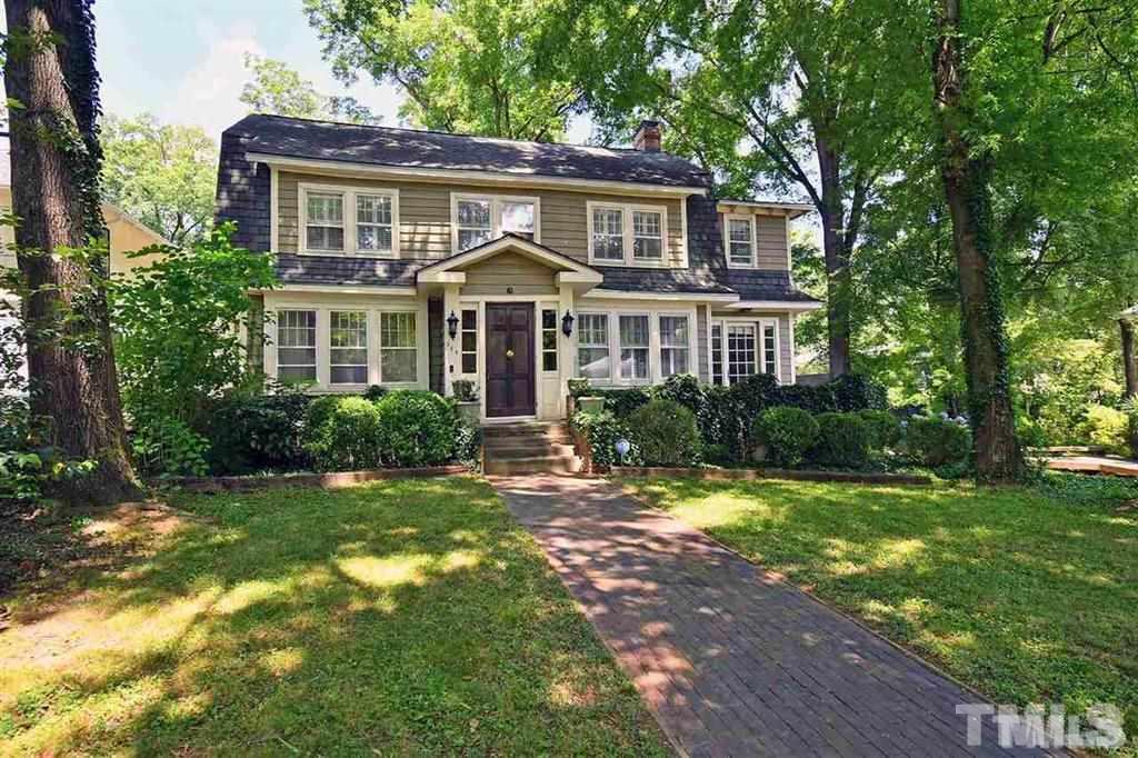 225 Hillcrest Road Raleigh, NC 27605 - Photo 1 of 18 a front view of a house with a yard and green space