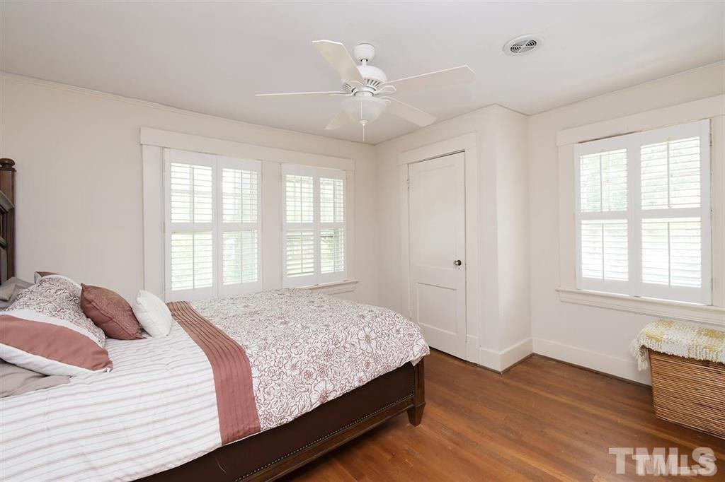 225 Hillcrest Road Raleigh, NC 27605 - Photo 14 of 18 a bedroom with a bed and a window