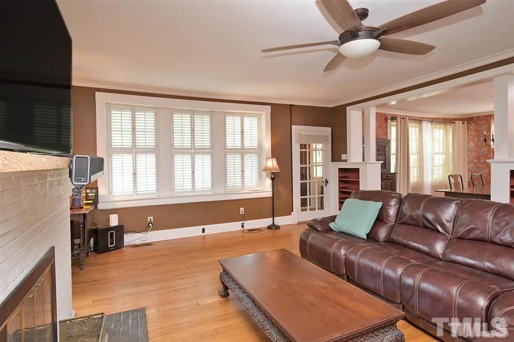 225 Hillcrest Road Raleigh, NC 27605 - Photo 3 of 18 a living room with furniture and a large window
