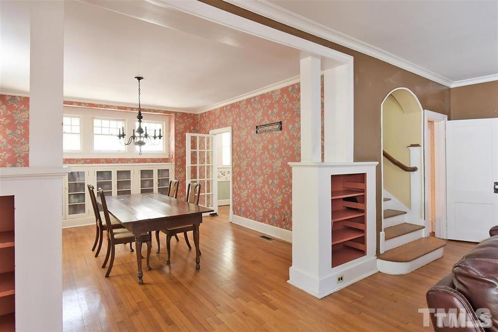 225 Hillcrest Road Raleigh, NC 27605 - Photo 4 of 18 a view of a dining room with furniture and wooden floor