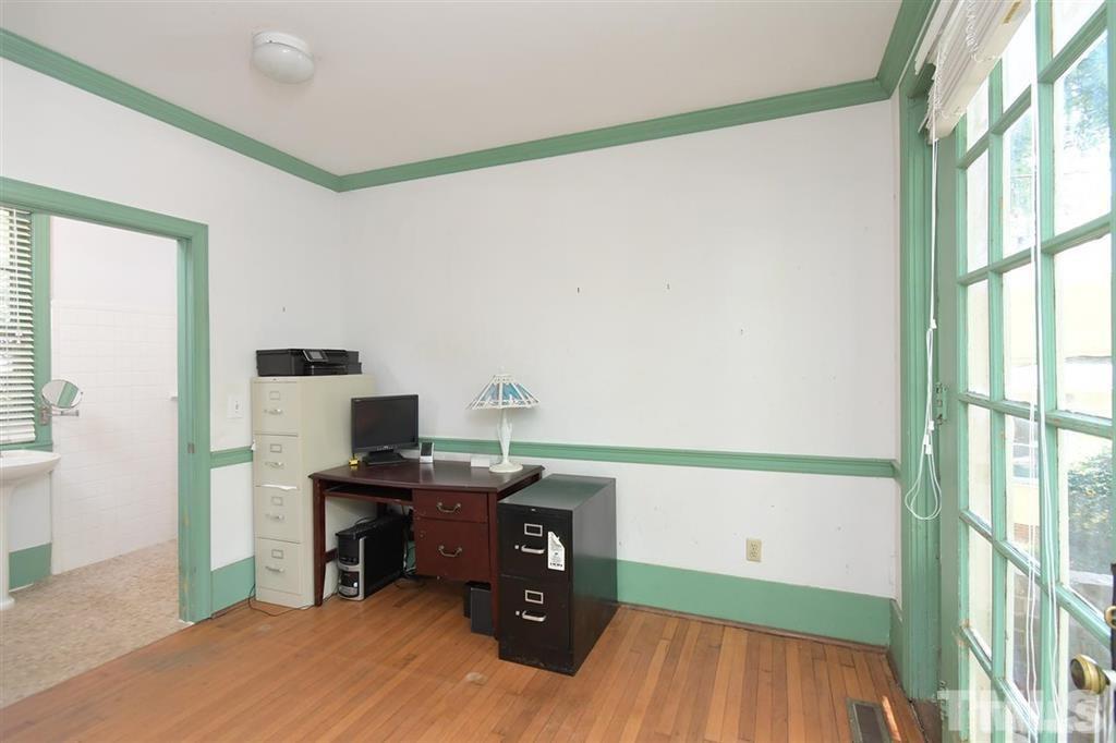 225 Hillcrest Road Raleigh, NC 27605 - Photo 6 of 18 a view of a workspace with furniture and a window