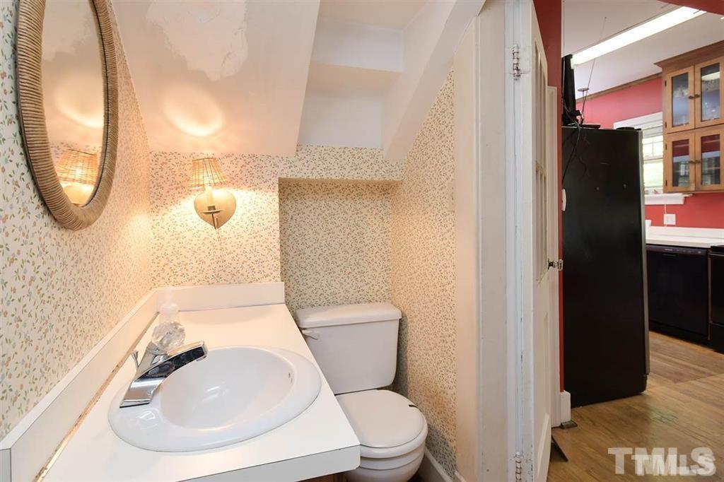 225 Hillcrest Road Raleigh, NC 27605 - Photo 8 of 18 a bathroom with a toilet and a sink