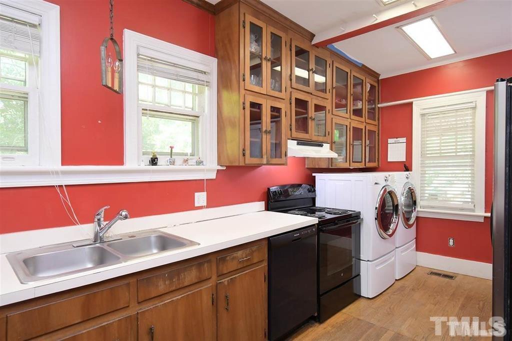 225 Hillcrest Road Raleigh, NC 27605 - Photo 9 of 18 a utility room with a sink and a window