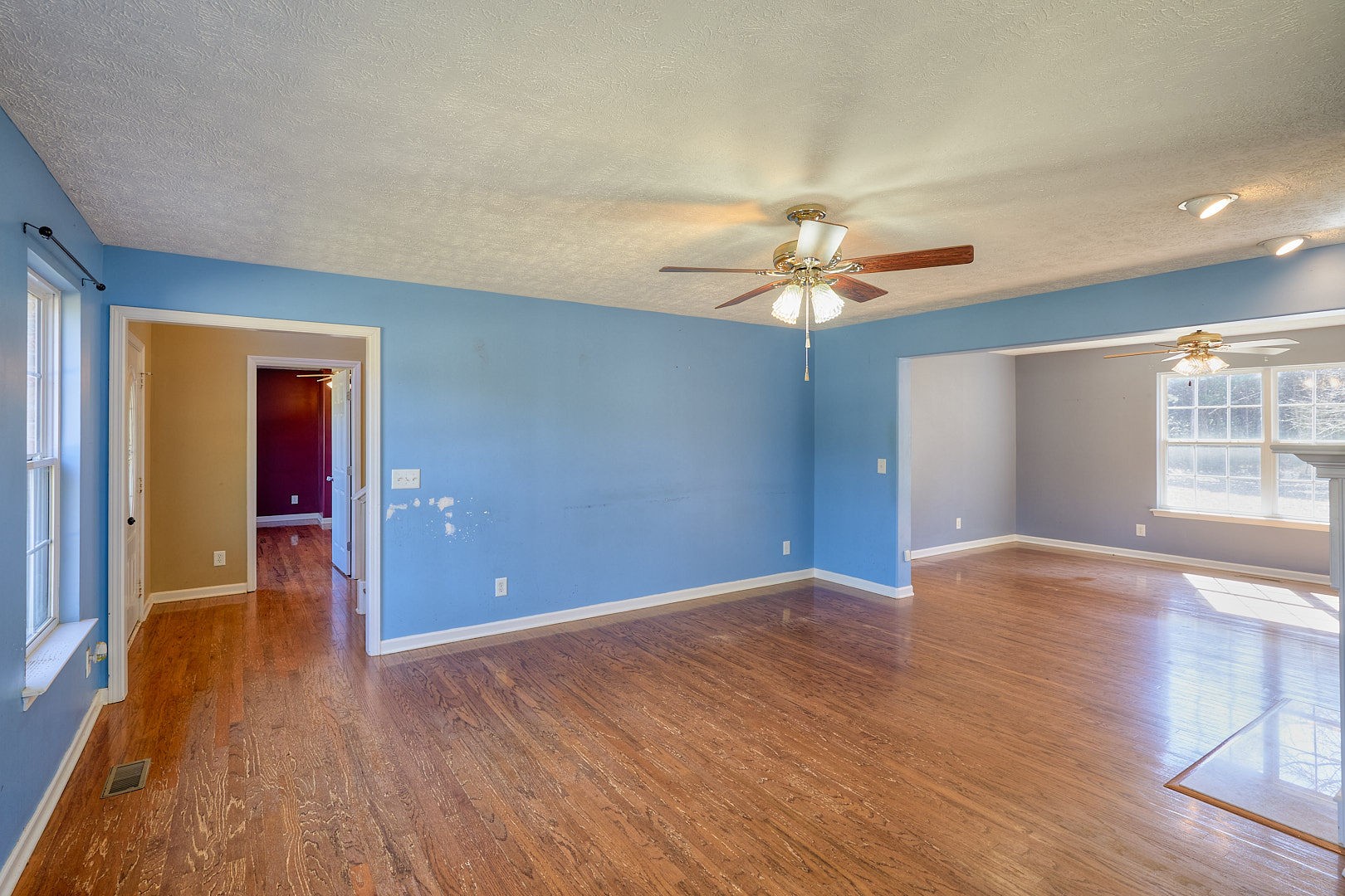 7042 Murfreesboro Road Lebanon, TN 37090 - Photo 13 of 43 a view of an empty room with window and wooden floor