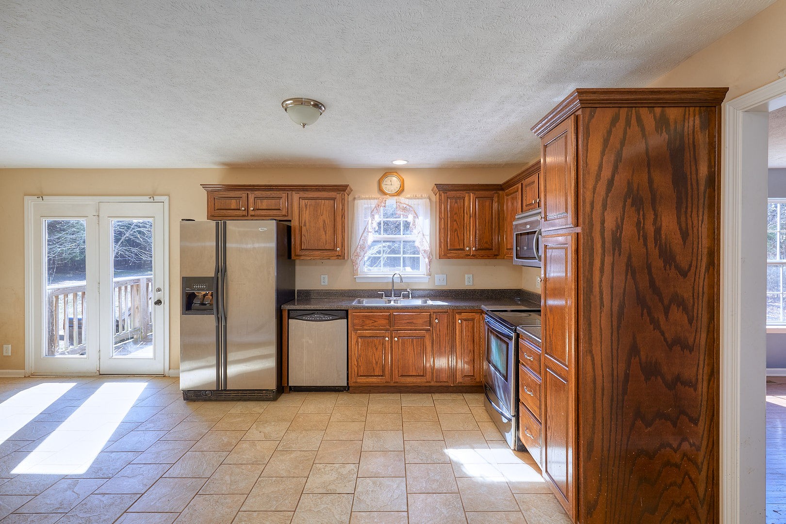 7042 Murfreesboro Road Lebanon, TN 37090 - Photo 16 of 43 a kitchen with stainless steel appliances granite countertop a refrigerator and a sink