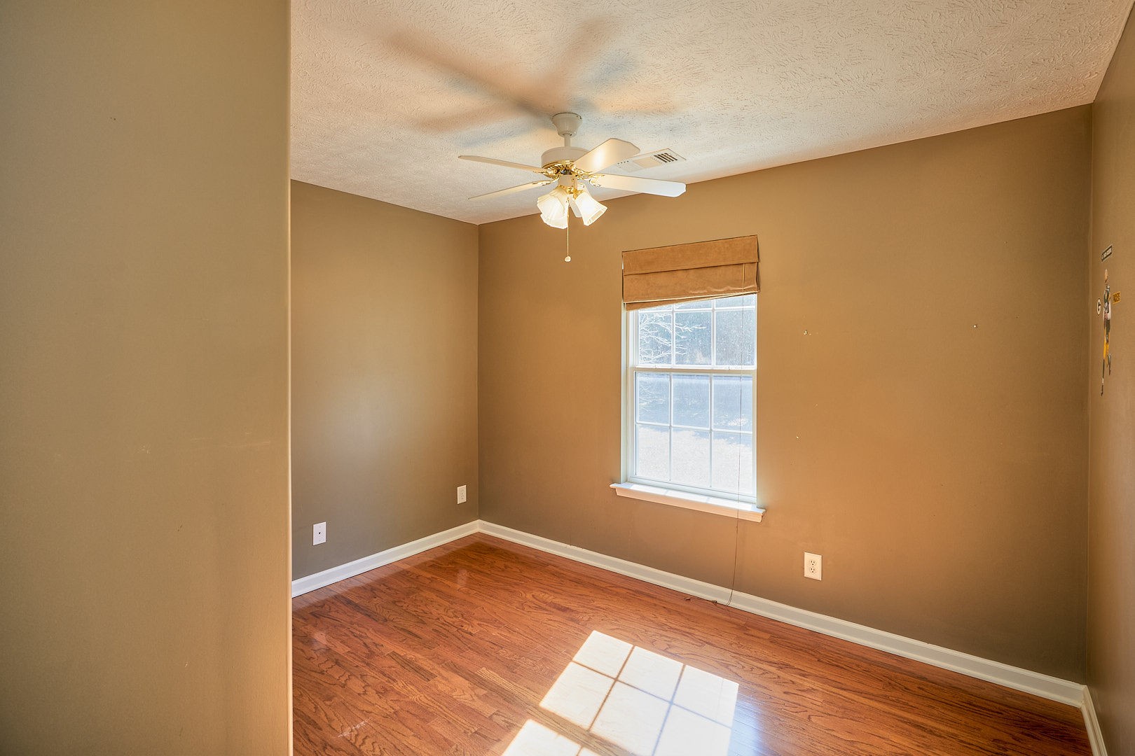 7042 Murfreesboro Road Lebanon, TN 37090 - Photo 24 of 43 an empty room with a window and a fan