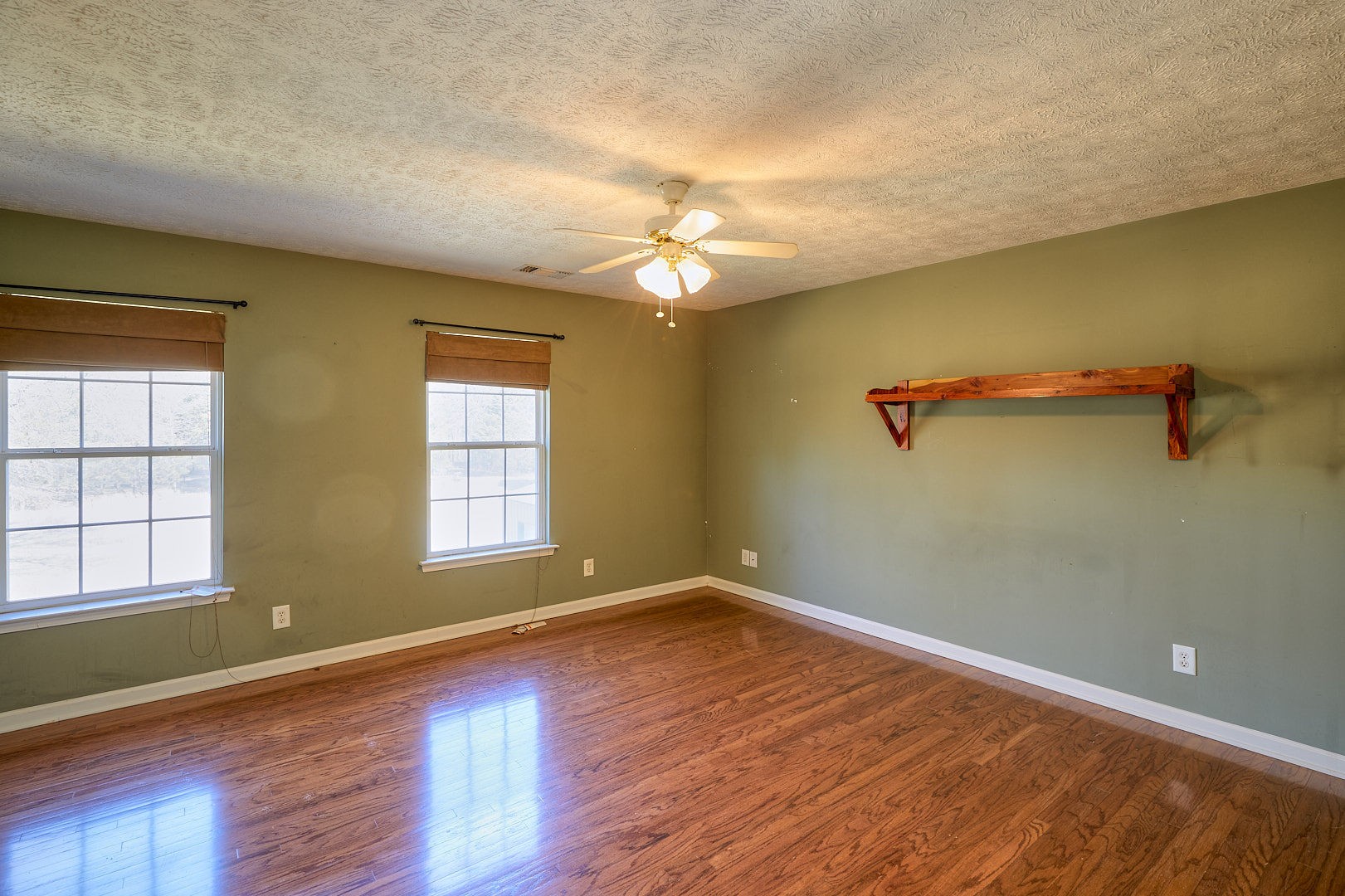 7042 Murfreesboro Road Lebanon, TN 37090 - Photo 25 of 43 wooden floor in an empty room with a window