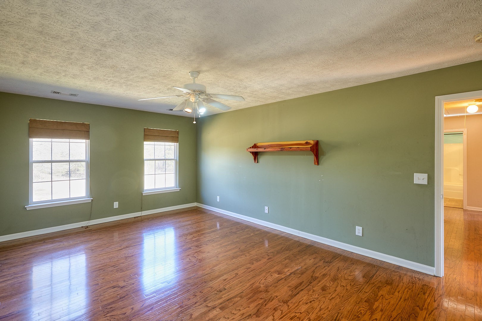 7042 Murfreesboro Road Lebanon, TN 37090 - Photo 27 of 43 an empty room with wooden floor and windows